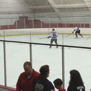 Charity game goes beyond ice, honors Dennison, MacDonald