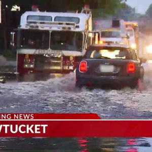 Car attempts to drive through flooded roadway in Pawtucket